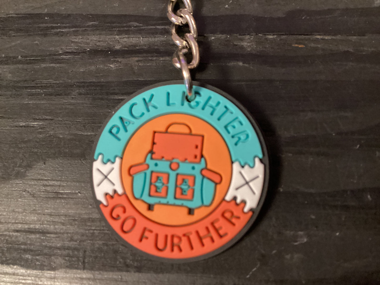 Pack Lighter Go Further Rubber Circle Keychain